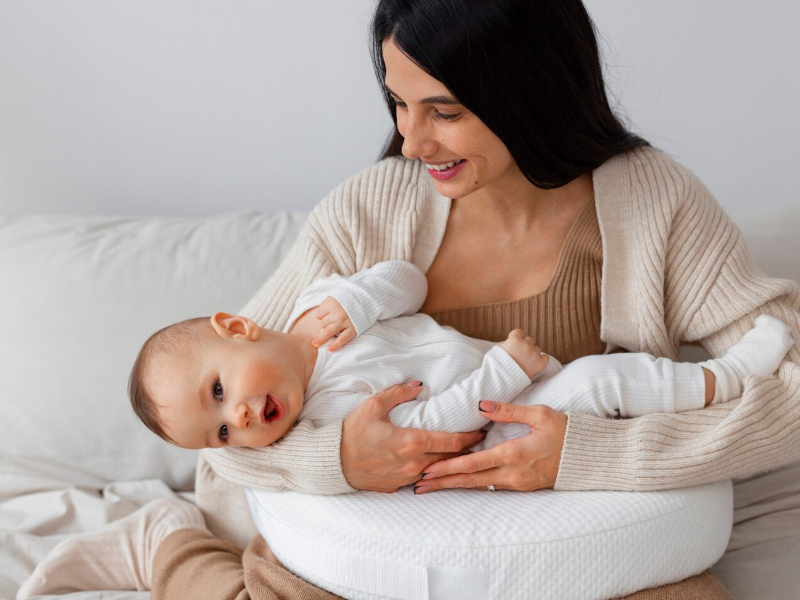 Is Using A Nursing Pillow Helpful for Babies Who Frequently Spit Up Milk?